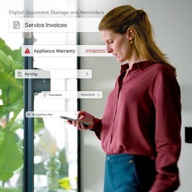 A manager reviewing stored service invoices, warranties, and reminders on her phone
