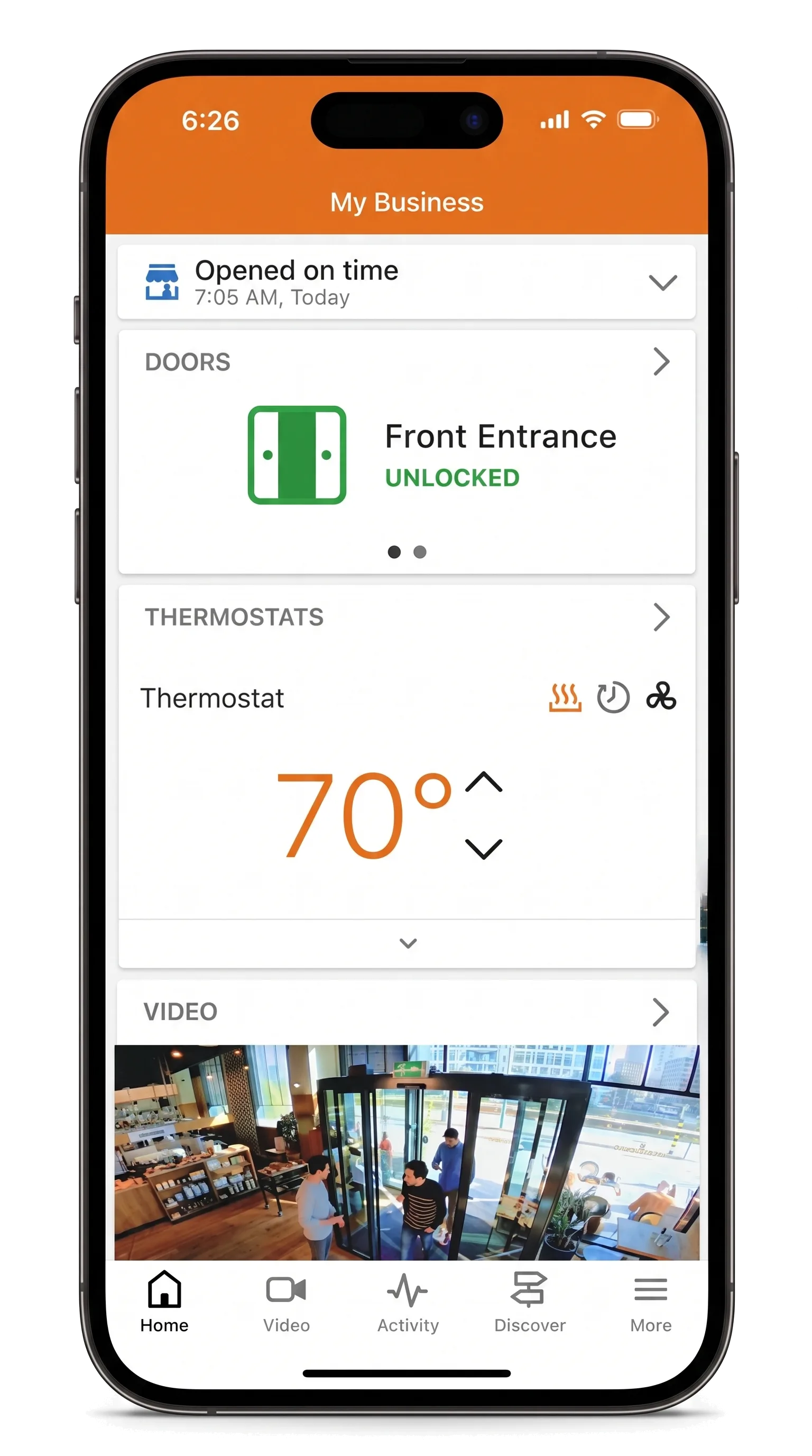 The app confirming the business opened on time, with doors and thermostat in view